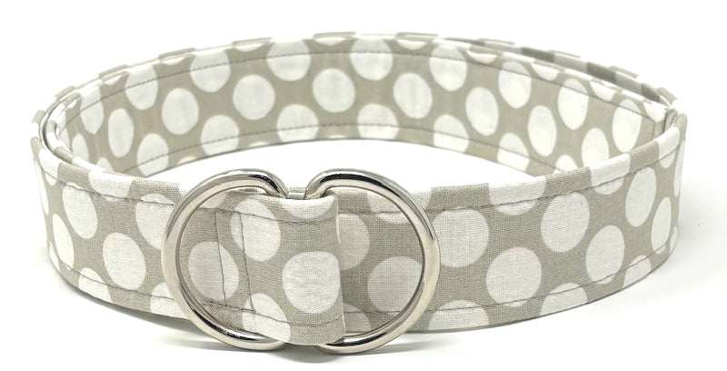 White mod polka dot D-ring belt on grey background by Oliver Green