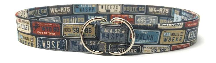 Travel-inspired durable belt featuring vintage license plate design and double ring buckle, 1.5 inches wide and 41.5 inches long.