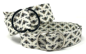 White bee-print fabric belt with black and silver D-ring buckles by Oliver Green