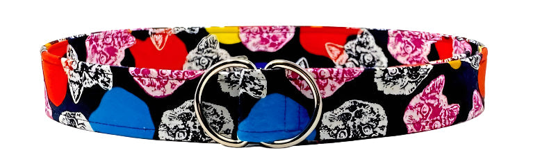 Black cotton d-ring belt with colorful cat head prints in orange, fuchsia, and royal blue