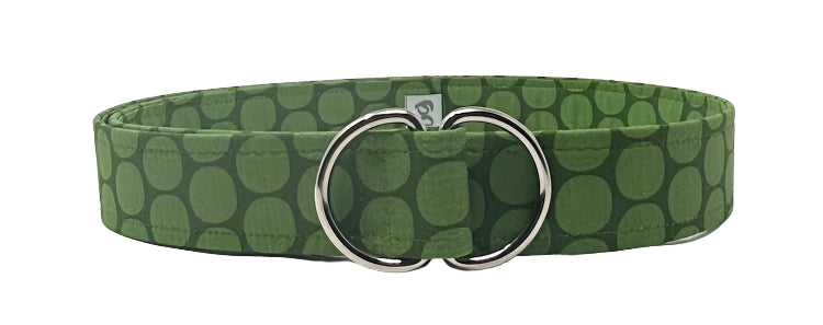 Retro polka dot belt with oversized green-and-white dots on cotton webbing and silver D-ring buckle by Oliver Green.