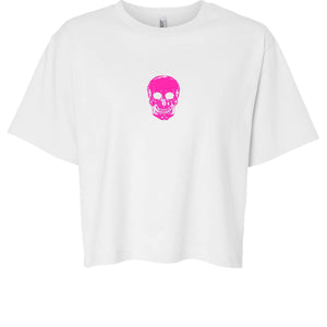 White boxy tee with centered hot pink skull graphic, minimalist streetwear design