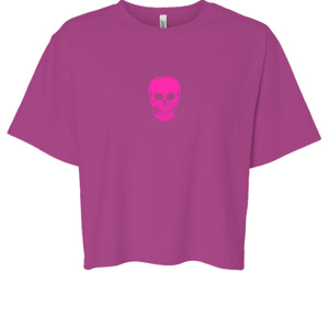 Hot pink boxy tee with minimalist skull graphic centered on chest, streetwear style