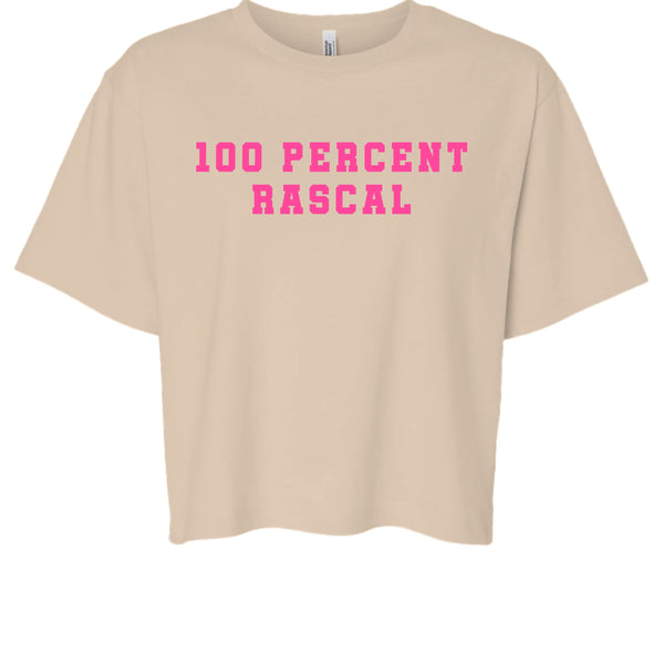beige cropped women's t-shirt with bold pink "100 Percent Rascal" graphic text, cheeky vibe crop tee