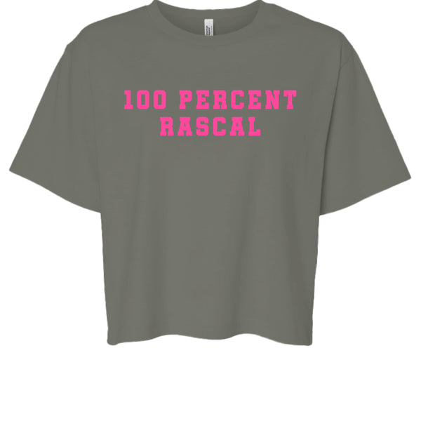 Women's cheeky vibe cropped tee with bold pink "100 Percent Rascal" print on soft beige fabric