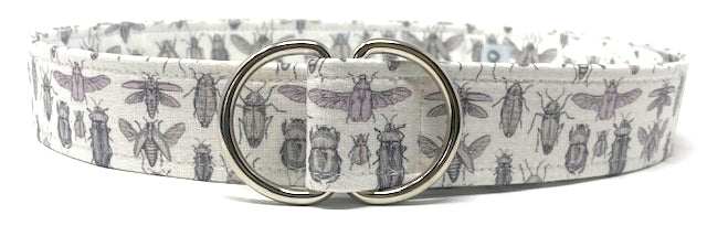 White D-ring belt with lavender beetle pattern on white background by Oliver Green